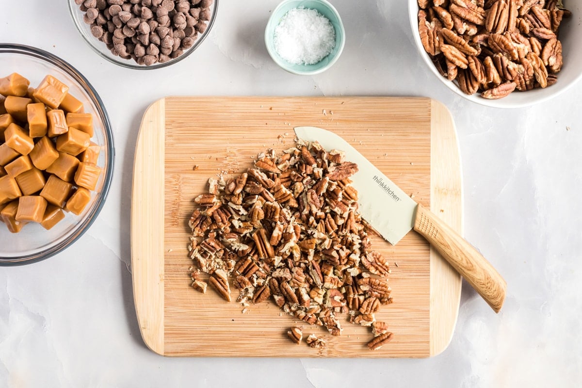 chopped pecans on a cutting board