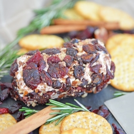 cranberry goat cheese roll with rosemary and crackers