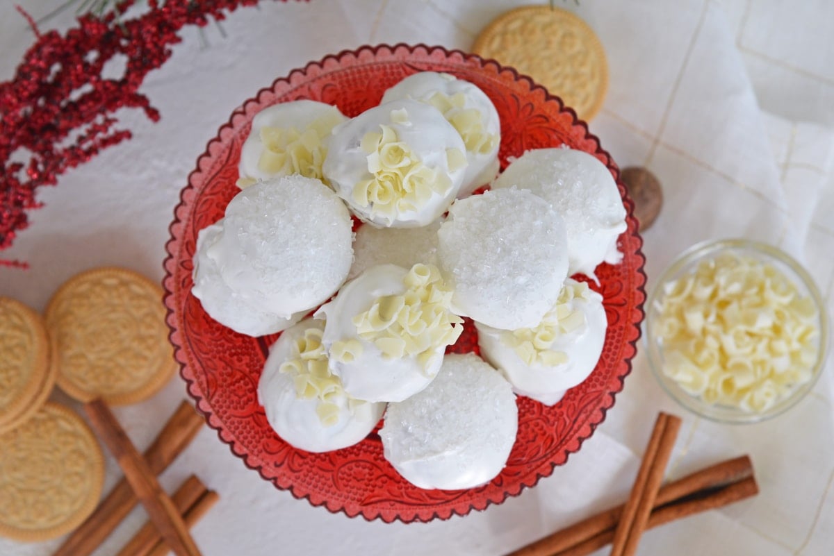 overhead of eggnog oreo cookie balls on a red platter 