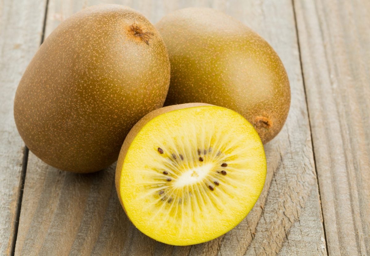 golden kiwi cut in half  