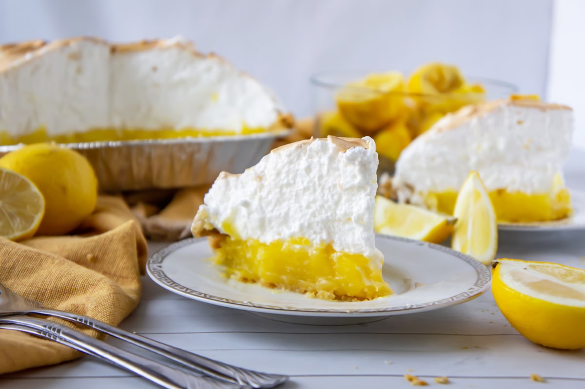 serving a slice of lemon meringue pie 