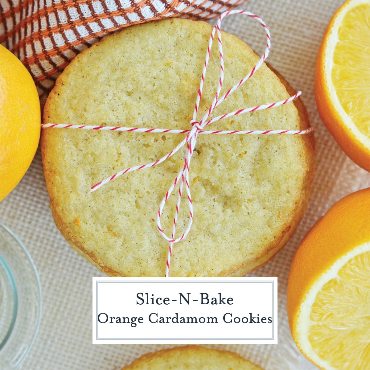 overhead of tied orange cardamom cookies with fresh oranges 