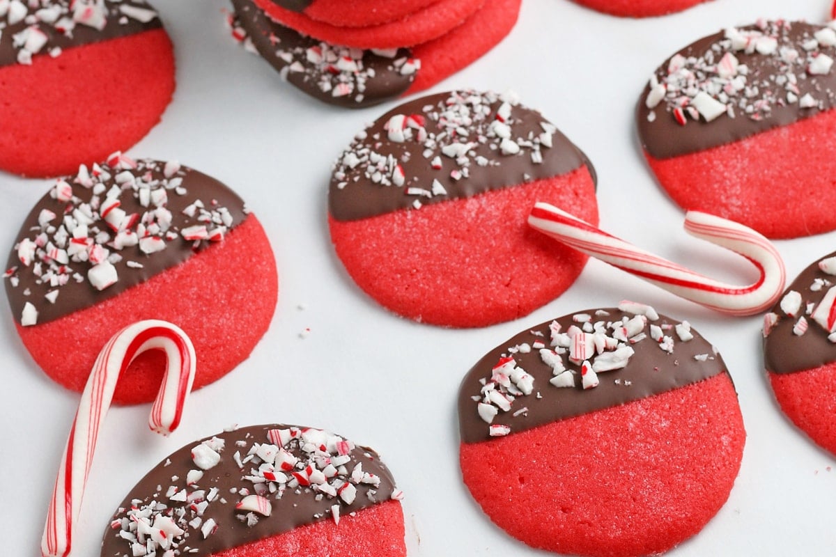 red cookies with peppermint on a piece of parchment paper 