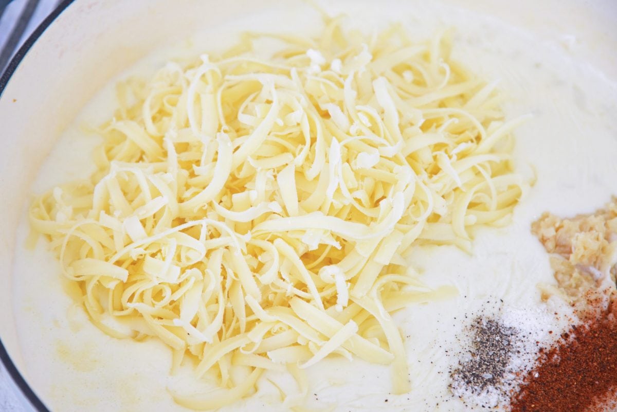 shredded cheese in a roux sauce 