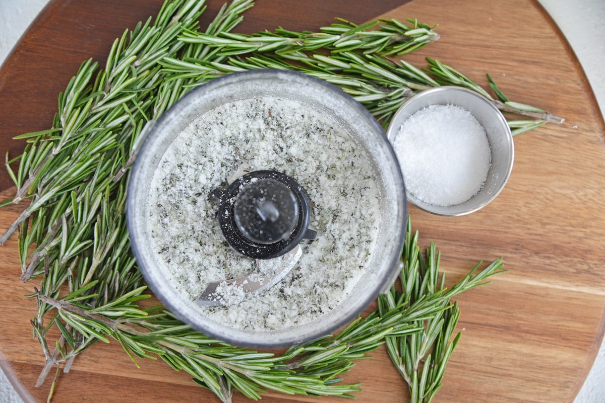 overhead of rosemary salt in a food processor 