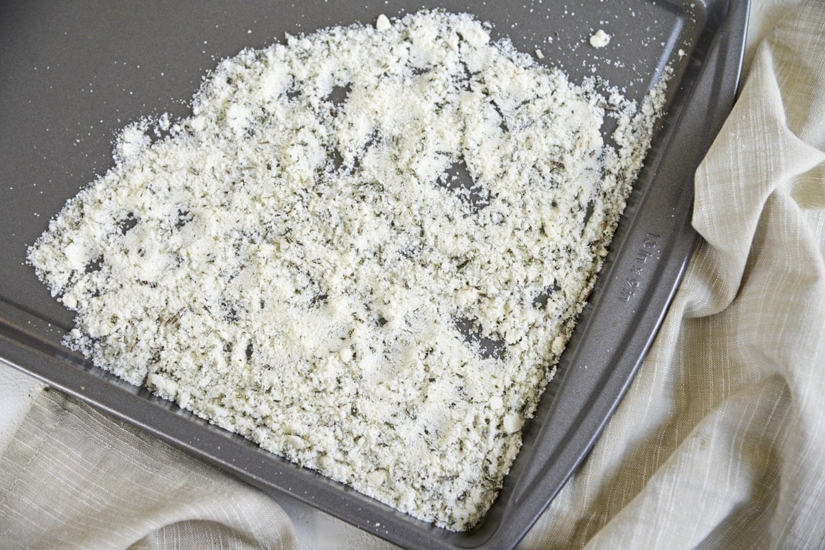 rosemary salt drying on a rimmed baking sheet 