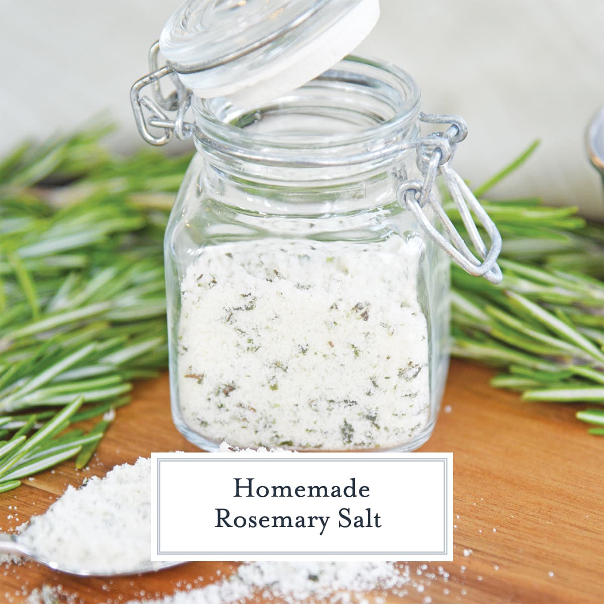 glass jar of seasoned salt and fresh rosemary 