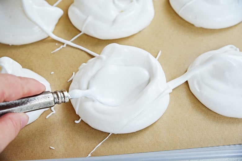 making wells in meringue cups 