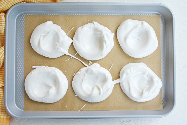 baking sheet with six meringue cups 