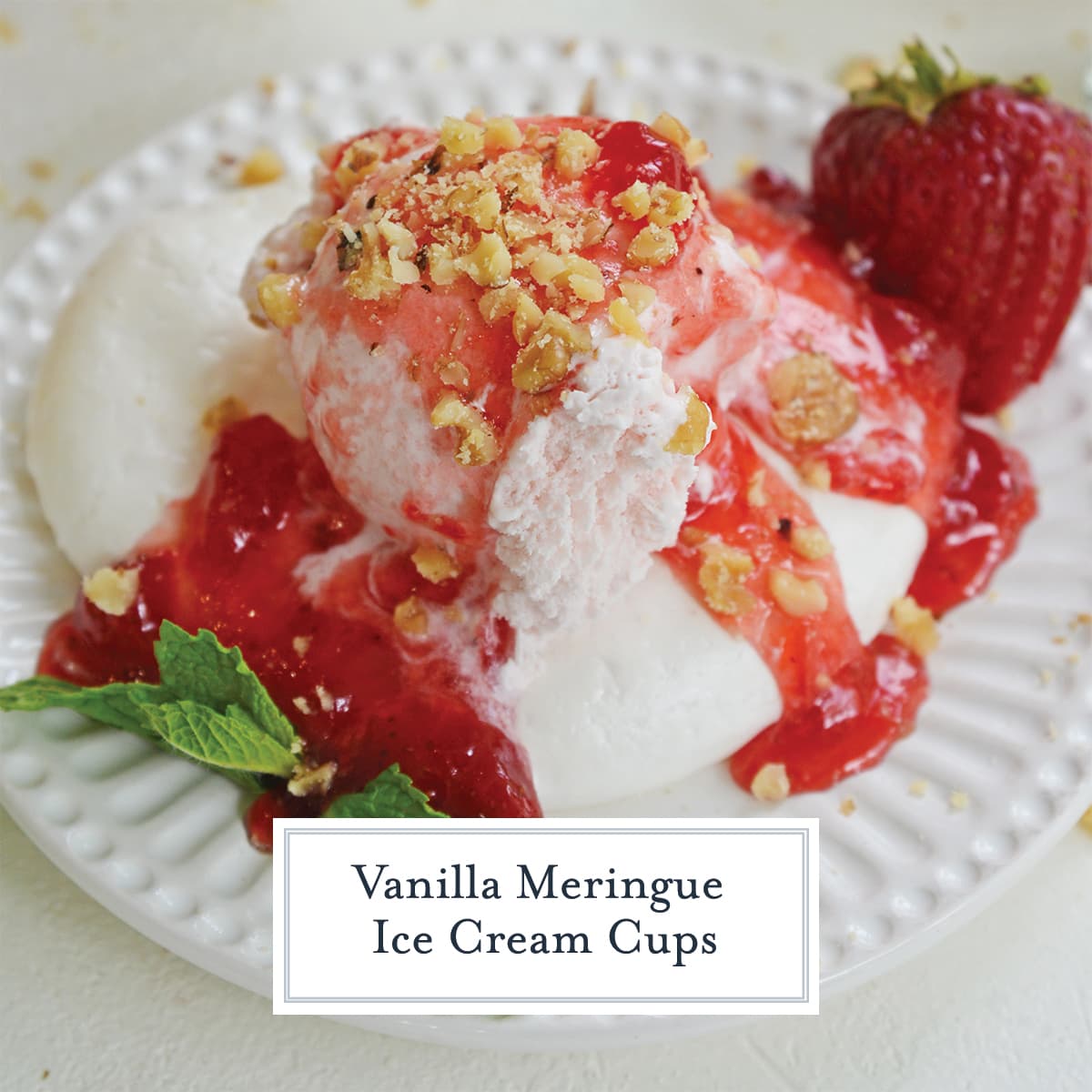 close up of strawberry ice cream in a meringue cup with strawberry topping 