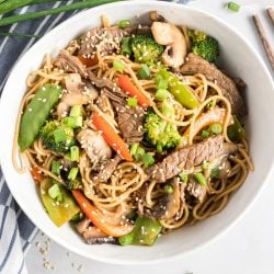 overhead of lo mein in a white bowl