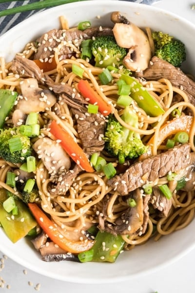 overhead of lo mein in a white bowl