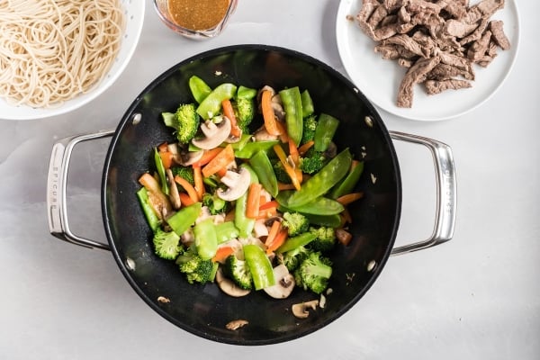 sauteed vegetables in a wok