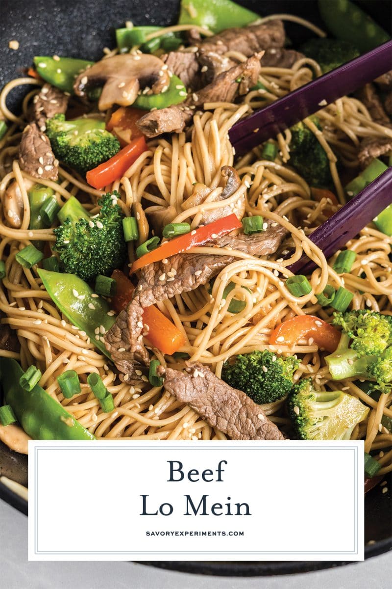 close up of beef lo mein with tongs for pinterest  