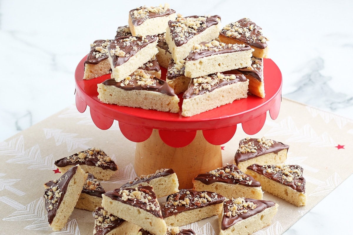 red plate of frosted cookie bars 