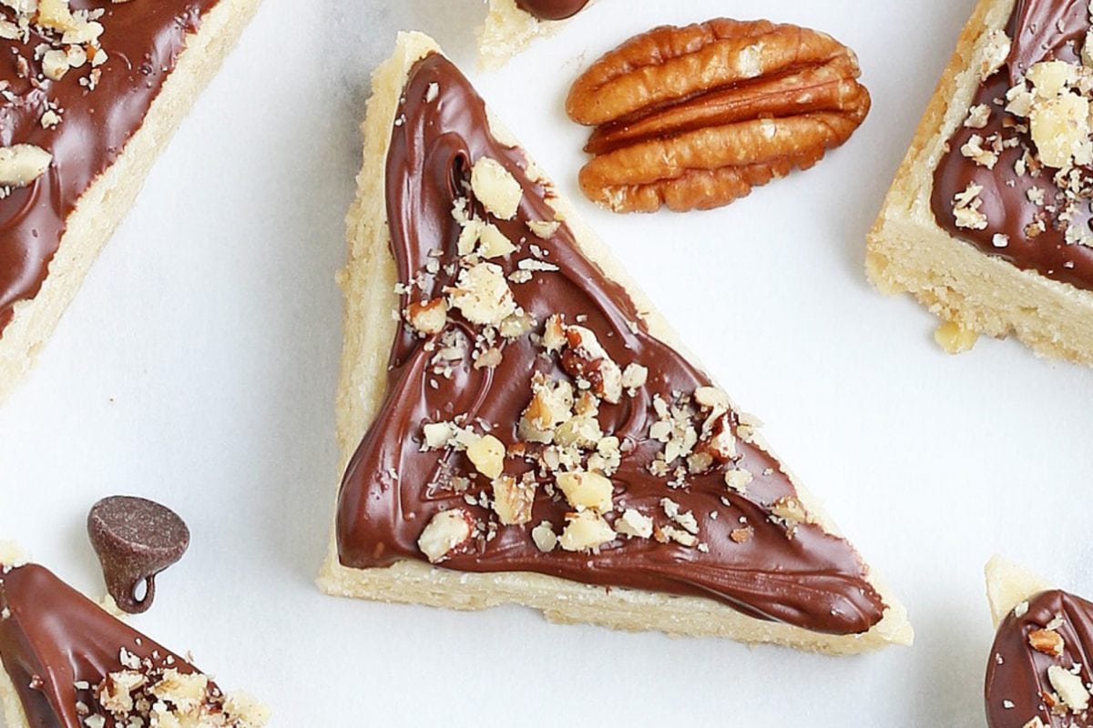 close up of chocolate frosted pecan cookie 