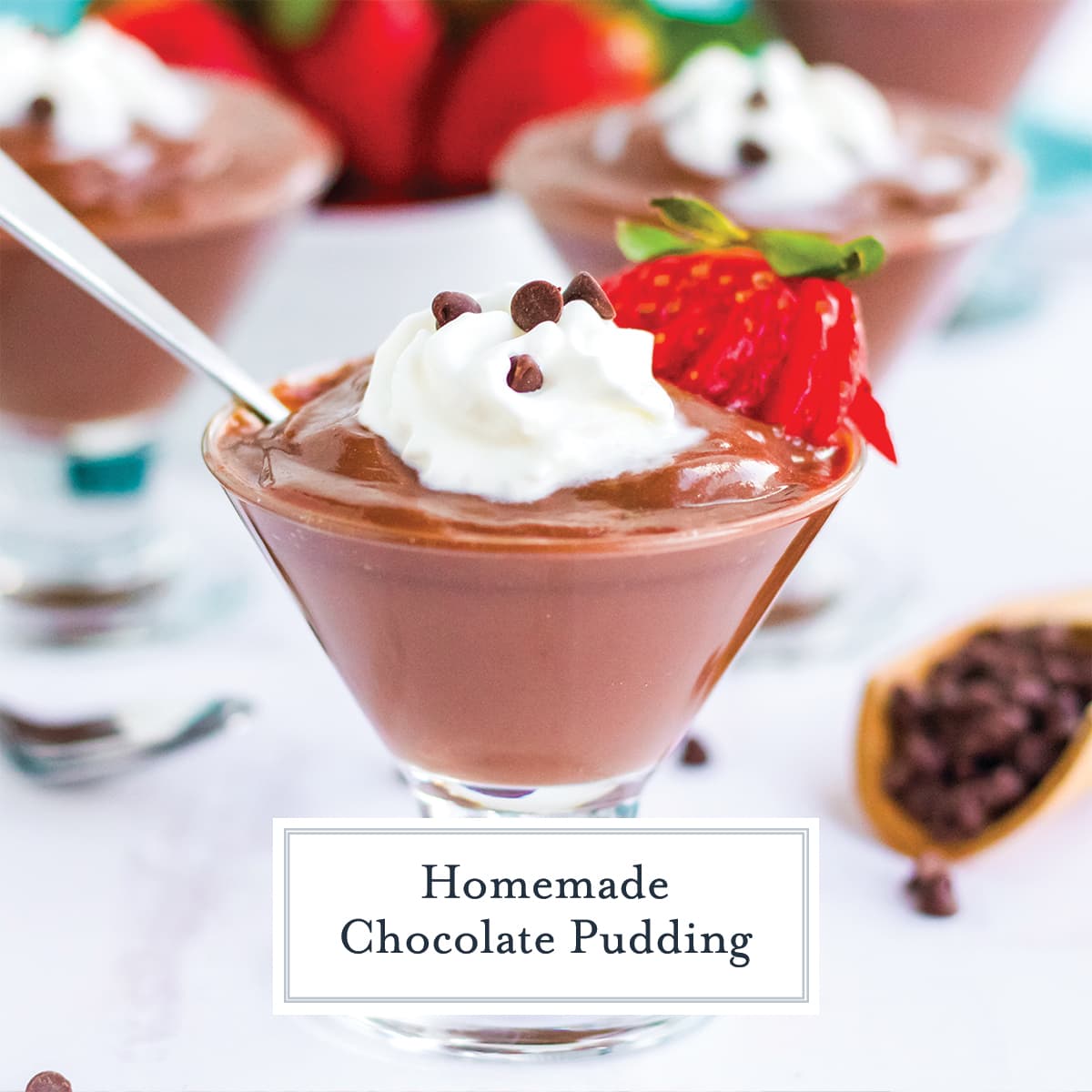 close up of chocolate pudding in a glass cup with whipped cream and strawberry