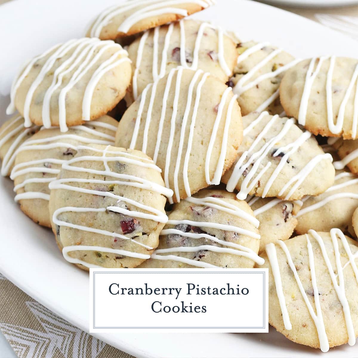 cranberry pistachio cookies on a white serving platter 