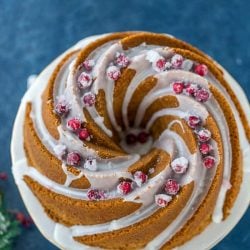overhead shot of eggnog bundt cake topped with cranberries