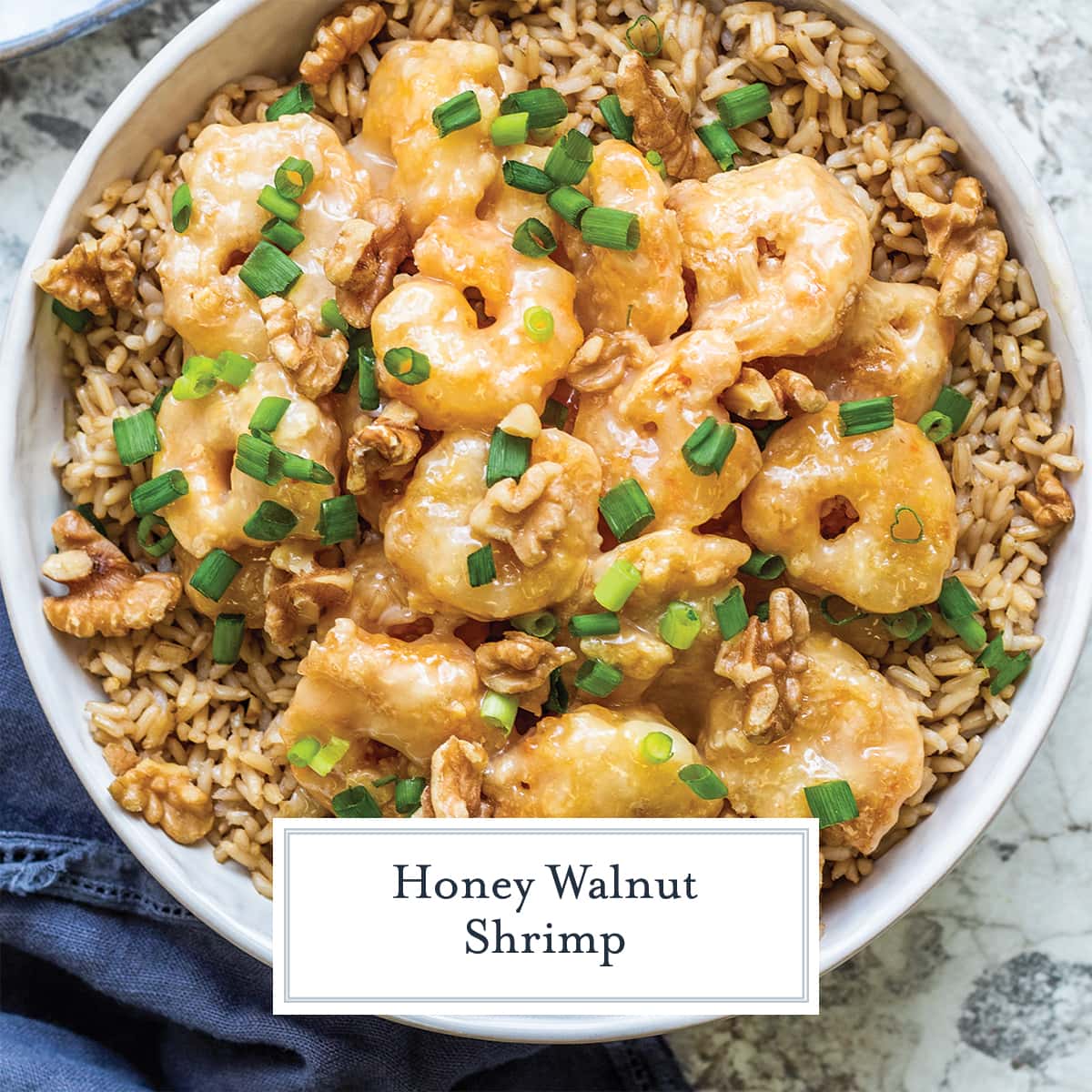 overhead of honey walnut shrimp over brown rice with scallions 