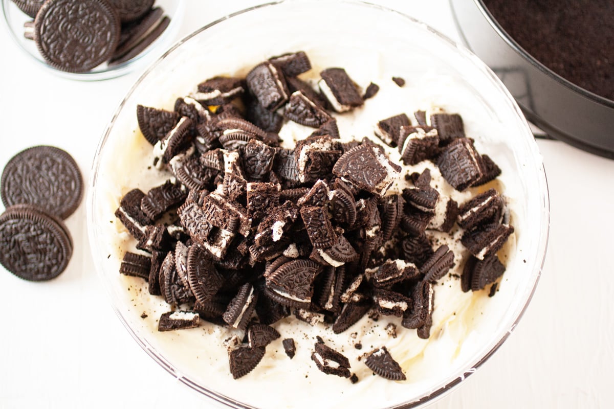 chopped oreos in a white mixing bowl 