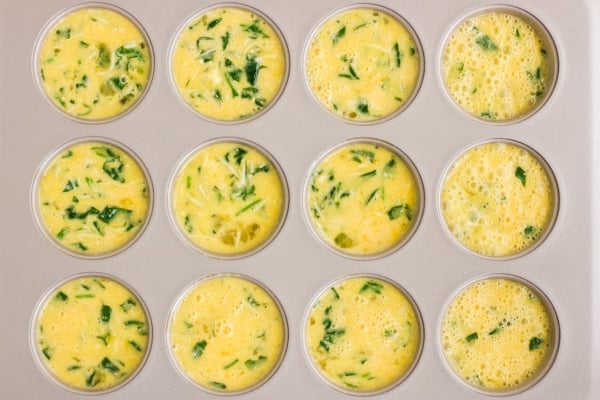 egg muffin mix in a muffin tin