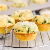 close up of quiche florentine muffins on a cooling rack