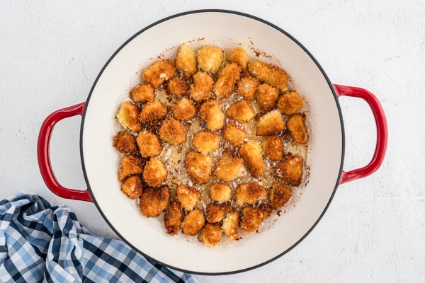 frying chicken in a skillet