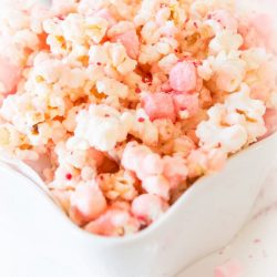 white chocolate peppermint popcorn in a white bowl