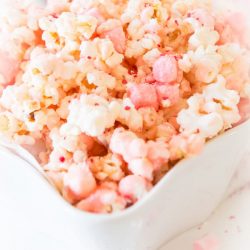 white chocolate peppermint popcorn in a white bowl