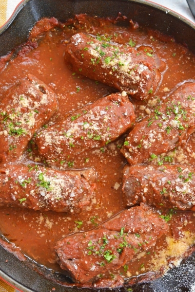 overhead of beef braciole in a skillet