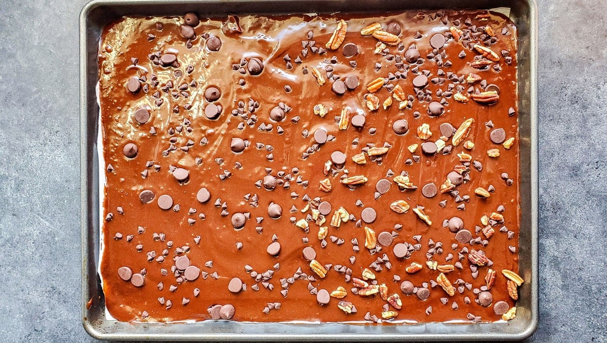 spread brownie brittle batter in a rimmed baking sheet 