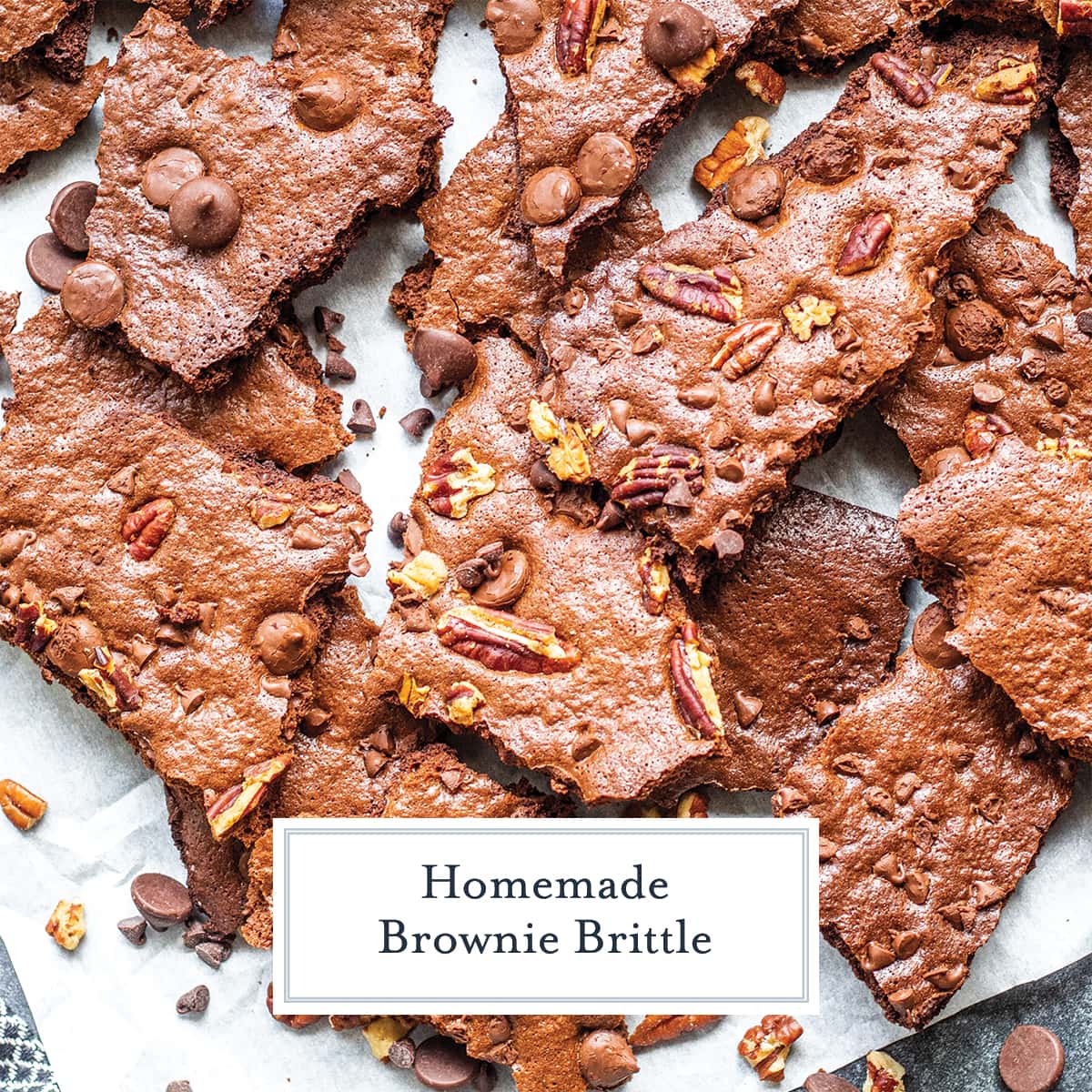 broken brownie brittle on white parchment 