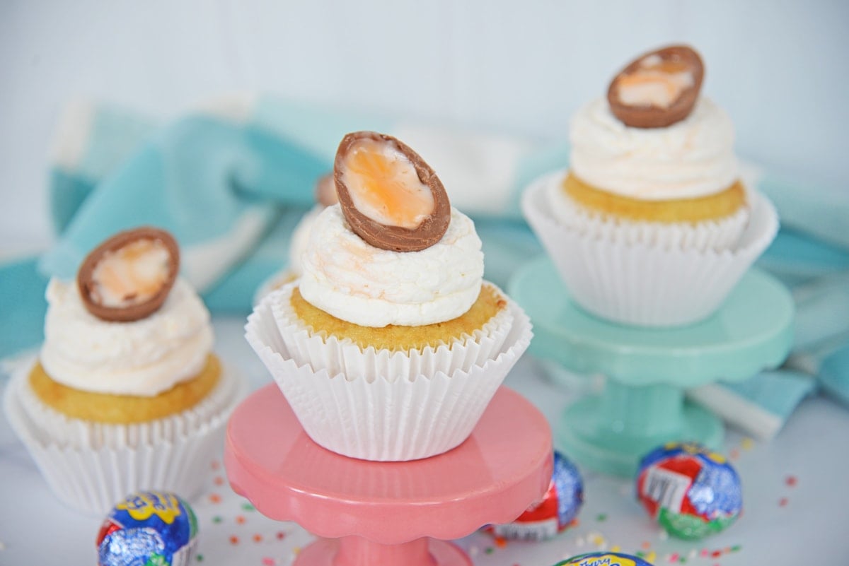 cadbury egg cupcakes on pedestals