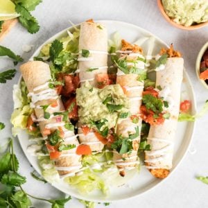 plate of baked chicken taquitos