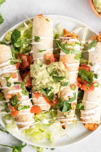 plate of baked chicken taquitos