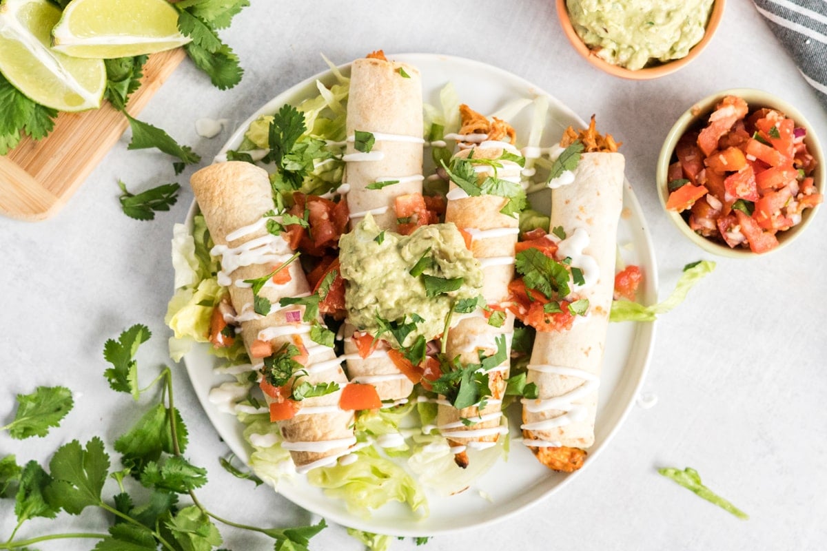 plate of baked chicken taquitos