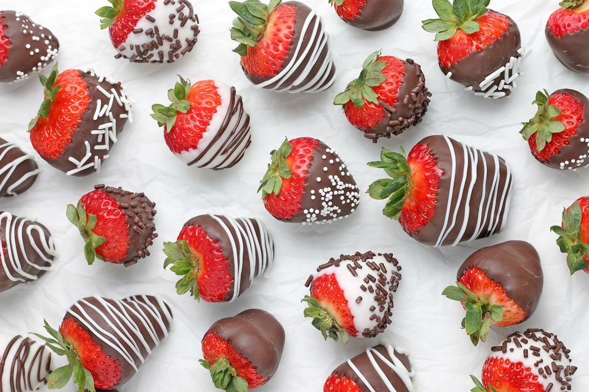 chocolate covered strawberries on parchment 