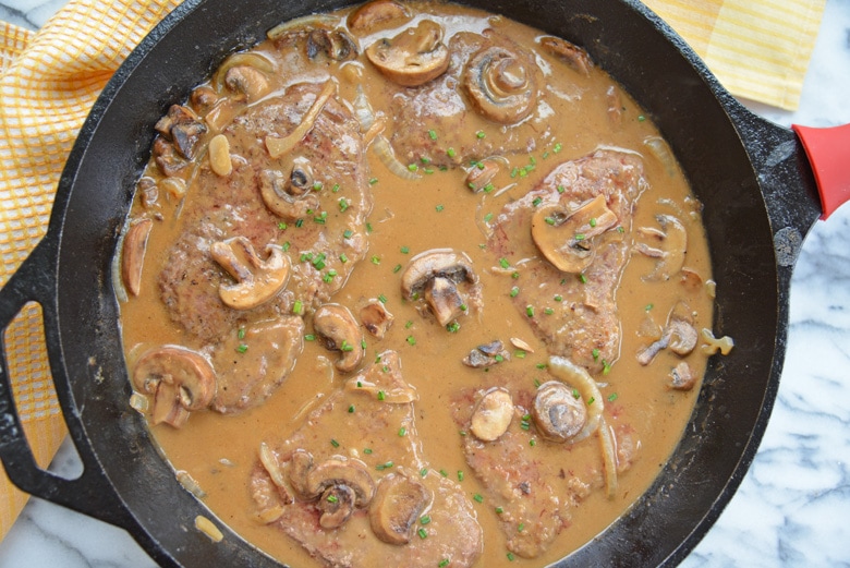 overhead of cast iron skillet with brown gravy