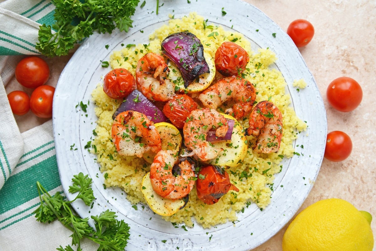 overhead shot of garlic shrimp and veggies over rice