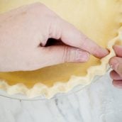 pinching together pie crust edges