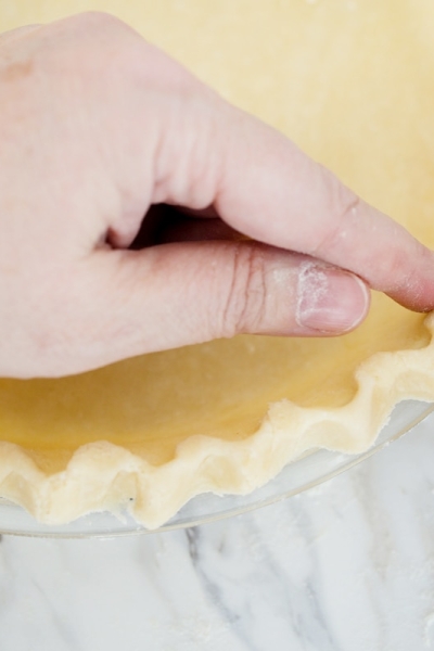 pinching together pie crust edges
