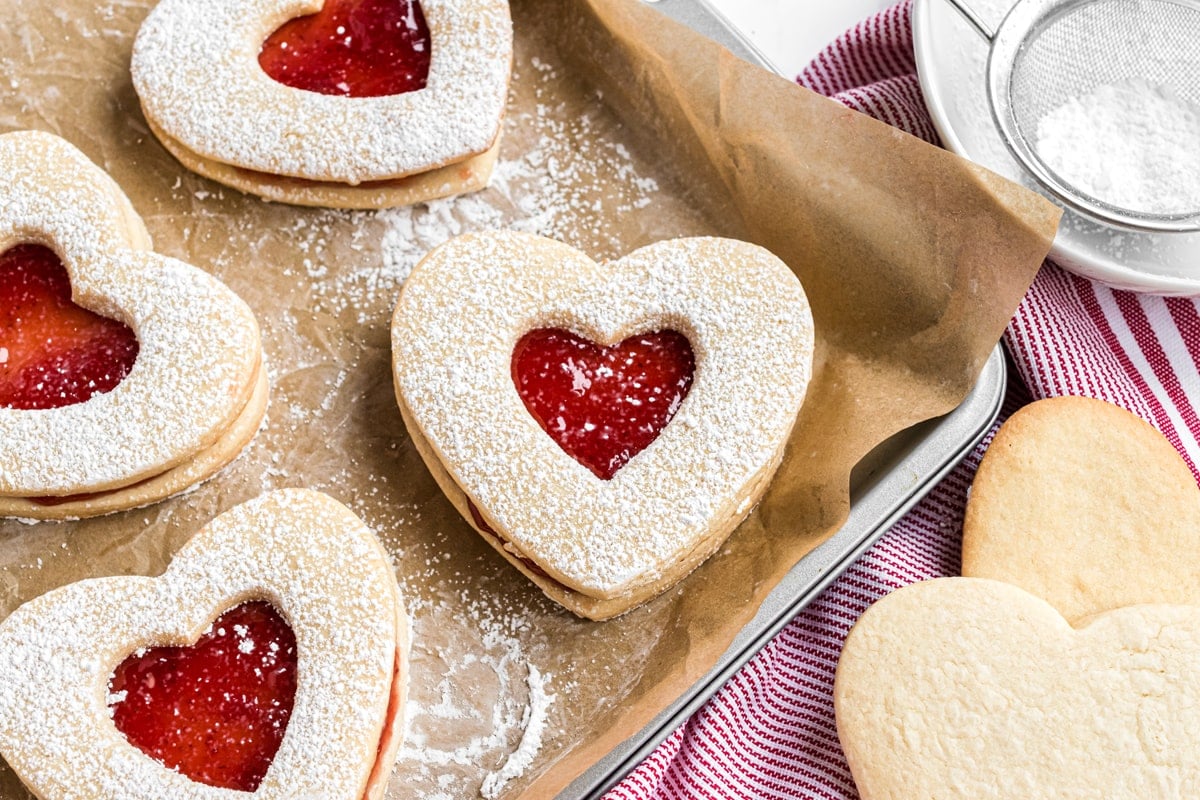 jammie dodgers cookies on parchment on a baking sheet  