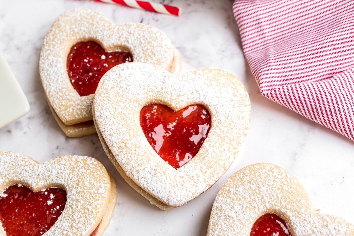 stacked jammie dodger cookies with red and white linen 