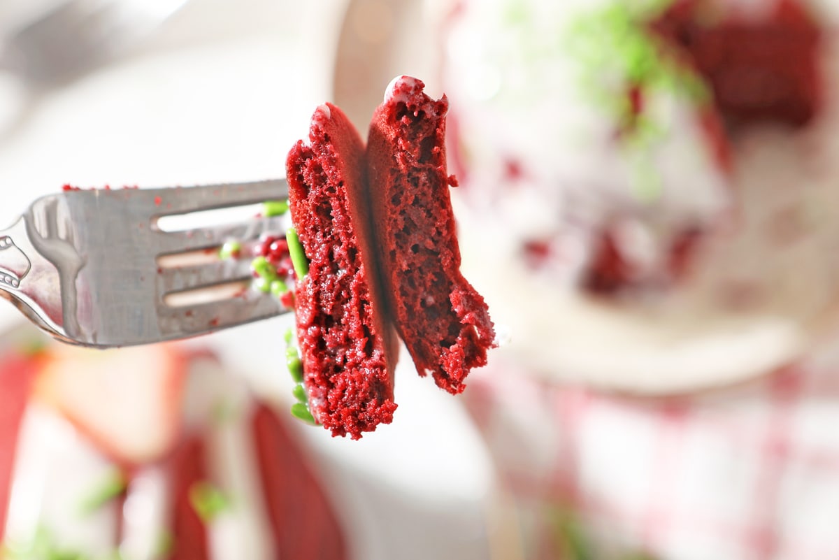 fork with a bite of red velvet pancakes 