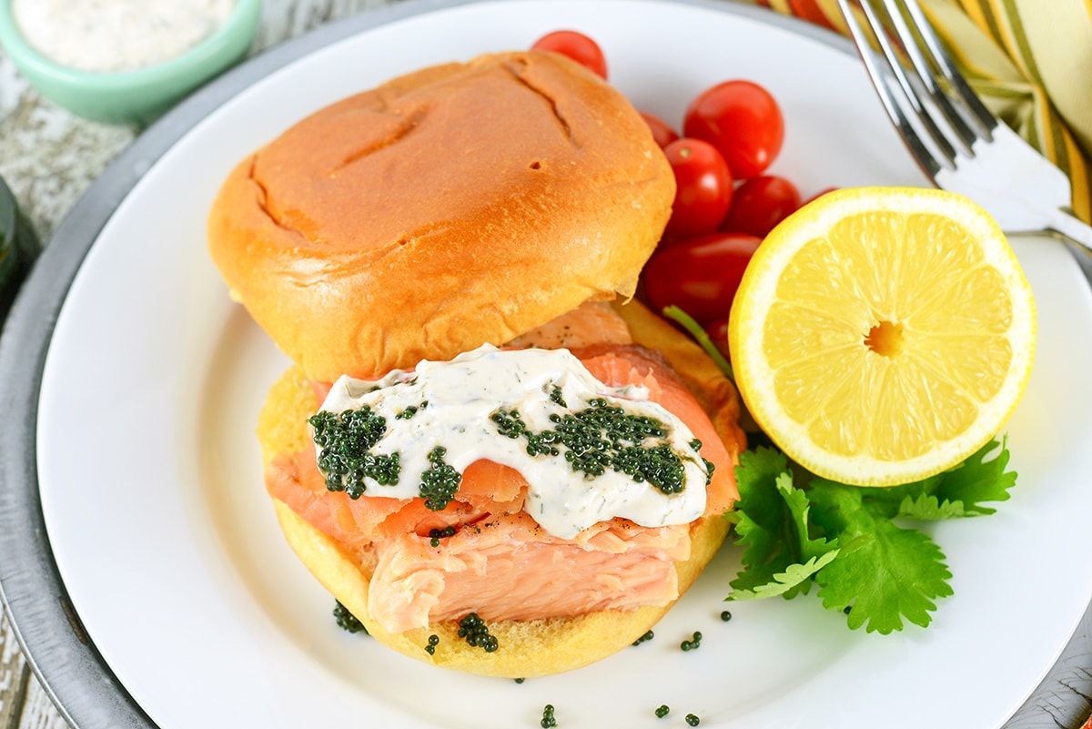 overhead of salmon sandwich with caviar and cream 