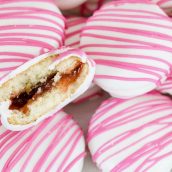 pile of no bake strawberry shortcake cookies with one halved