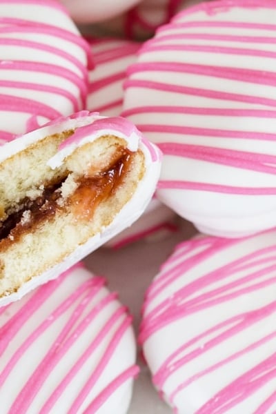 pile of no bake strawberry shortcake cookies with one halved