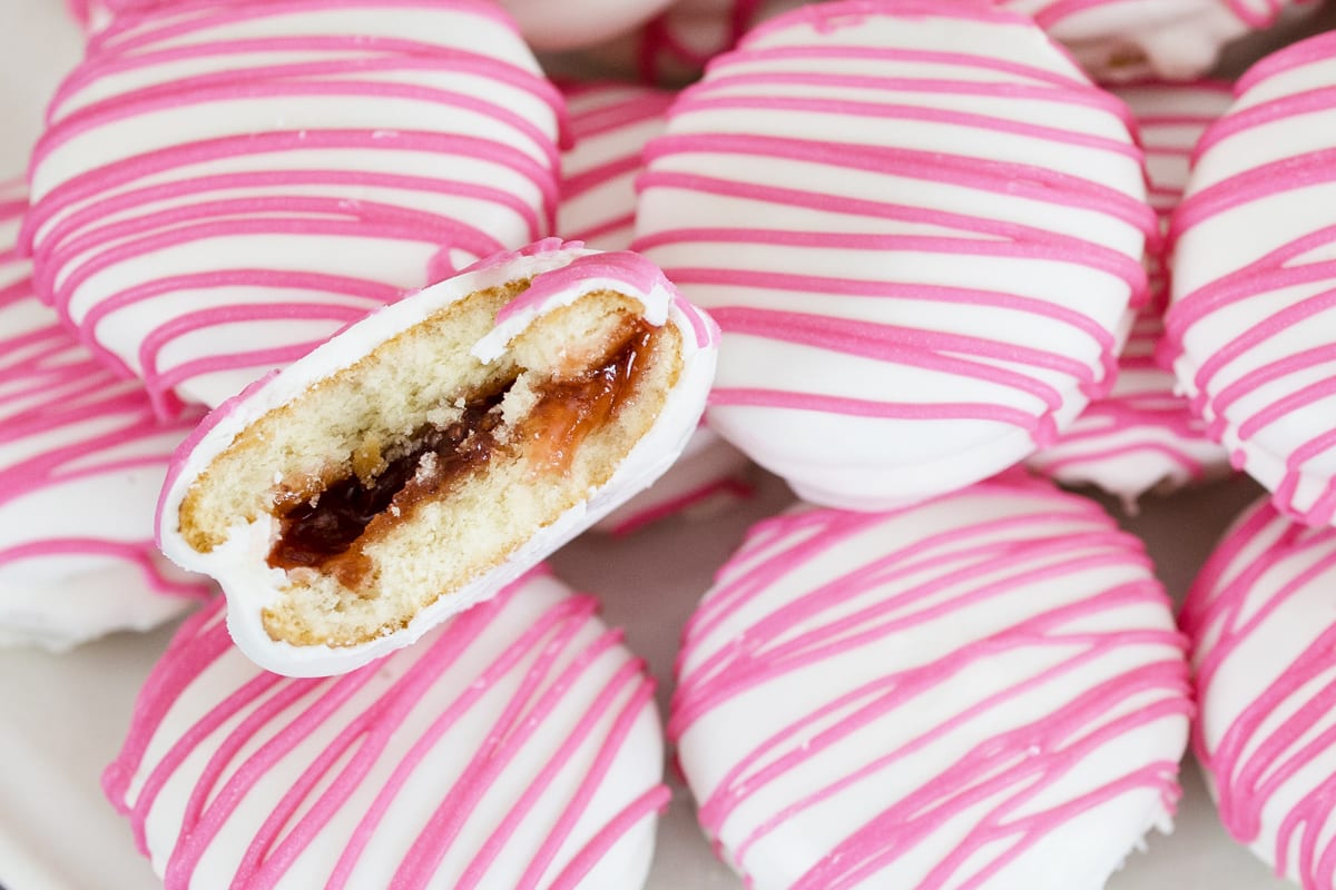 pile of no bake strawberry shortcake cookies with one halved