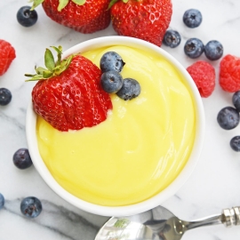 overhead of vanilla custard with fresh berries